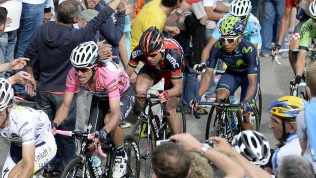 Cadel Evans keeps a close eye on race leader Rigoberto Uran during stage 14 of the Giro d'Italia.