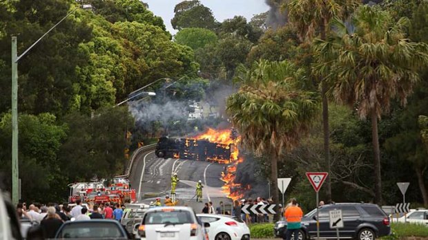 Two people died as a Cootes tanker rolled over and burst into flames in Sydney in 2013.