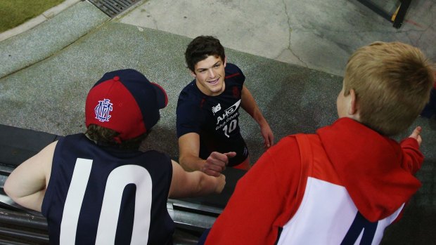 Angus Brayshaw is greeted by young fans.