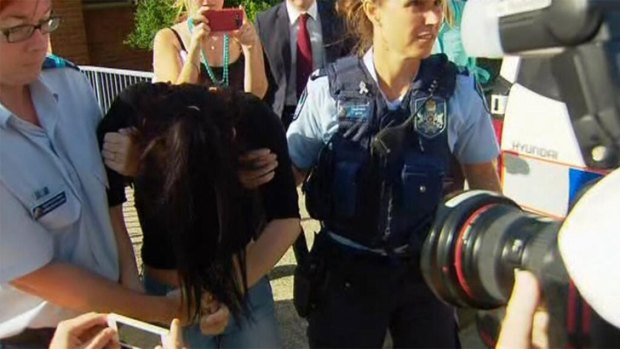 A 17-year-old girl is arrested at Coolangatta police station on the Gold Coast. Photo: Seven News.