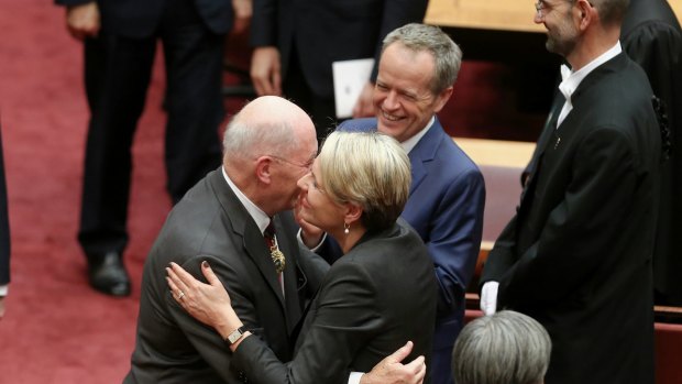 Governor-General Sir Peter Cosgrove embraces Deputy Opposition Leader Tanya Plibersek after the opening of the 45th Parliament.
