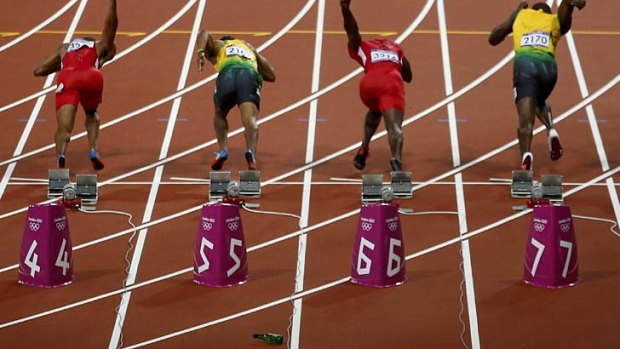 Man arrested ... the beer bottle bounces on the track just as the competitors start the race.