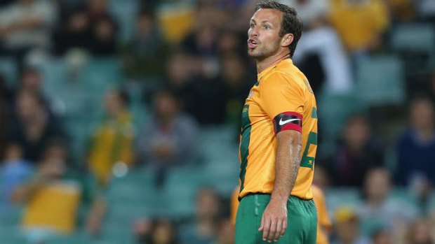 Under pressure:  Lucas Neill reacted after boos from the crowd.