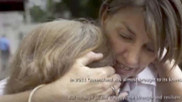 Campaign &#8230; television ad shows the Premier, Anna Bligh, comforting residents of Grantham after flash floods destroyed the town in January last year.