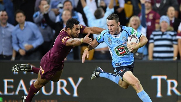 BRISBANE, AUSTRALIA - JUNE 22: James Maloney of the Blues runs in for a try during game two of the State Of Origin series between the Queensland Maroons and the New South Wales Blues at Suncorp Stadium on June 22, 2016 in Brisbane, Australia.  (Photo by Matt Roberts/Getty Images)
