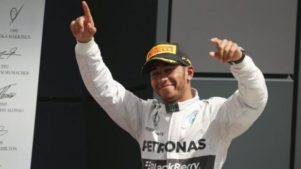 Lewis Hamilton waves to the crowd after winning the British Grand Prix on Sunday.