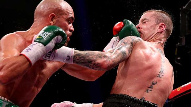 Ricky Burns (R) dislocated his jaw in the second round.