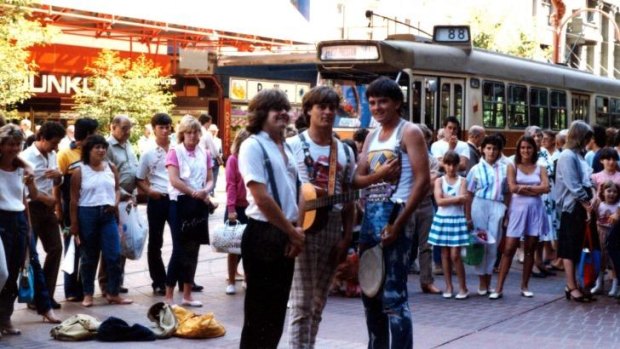Fond memories: Dave Bowers (centre) busking with friends Des Mullan (left) and John Weldon in Bourke Street Mall in the early '80s.
