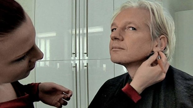 Julian Assange being prepared for a television interview. Courtesy of Universal.
