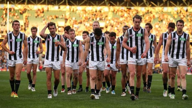 Collingwood players leave the ground after their 60-point loss to West Coast on Sunday.