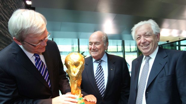 Prime Minister Kevin Rudd meeting FIFA boss Joseph Blatter, with help from FFA chairman Frank Lowy.