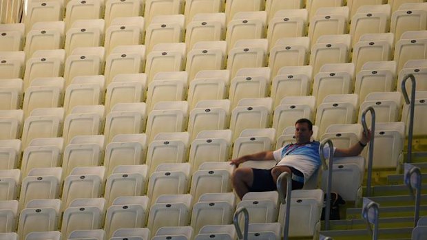 Lonely ... a lone spectator watches the swimming.