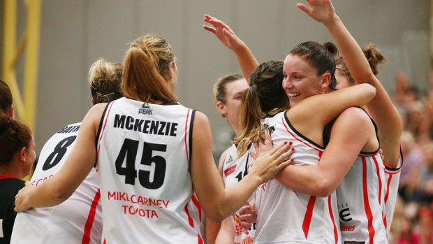 Townsville Fire players celebrate their win during the WNBL Preliminary Final match against the Dandenong Rangers