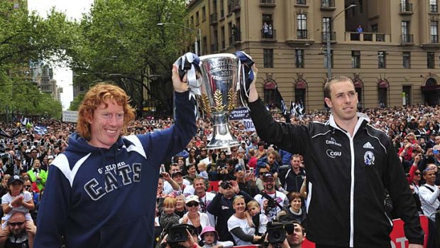 Cup in contention: Geelong captain Cameron Ling and Collingwood captain Nick Maxwell at the parade yesterday.
