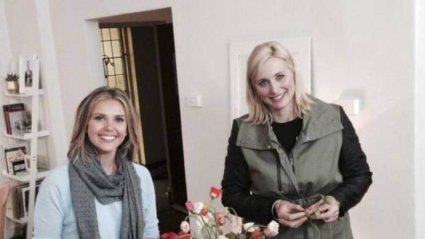 Sunrise weather girl Edwina Bartholomew shows Johanna Griggs a flower arrangement on Seven's Better Homes and Gardens on Friday night.