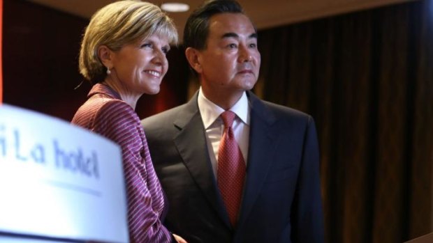 Australian Minister for Foreign Affairs Julie Bishop welcomes her Chinese counterpart Minister Wang Yi.
