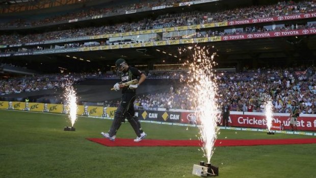 Let the fireworks begin: Cameron White heads out to bat for Australia at ANZ Stadium in February.