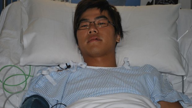 Hong Kong tourist Oscar Tsang faces another week in hospital after being bashed in Thornlie and robbed of $80.