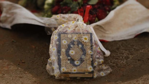Memorial: Ahmad Saleh's koran lays on top of his grave in the Hezbollah Martyr cemetery in Brital village, Lebanon.