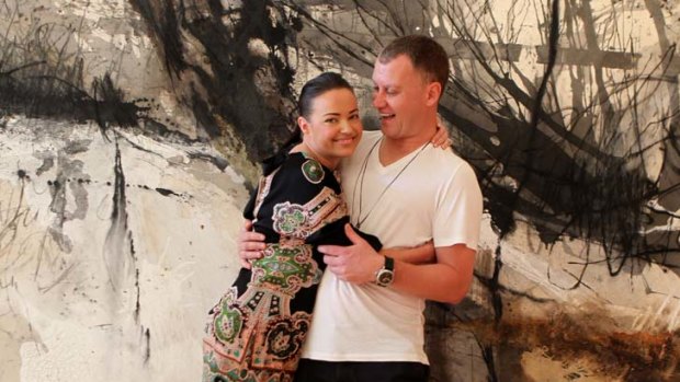 The price of love &#8230; Felicity Smith and Paul Lowe with the $12,000 Sophie Cape painting they are asking wedding guests to contribute towards.