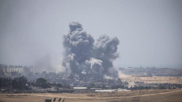 Smoke rises from Gaza after Israeli shelling on Sunday.