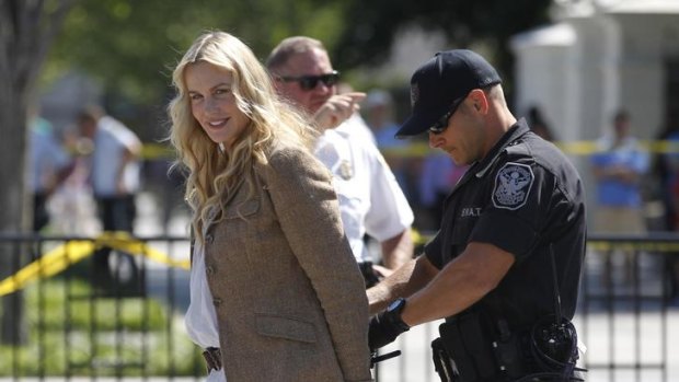 Clean energy advocate ... Daryl Hannah is arrested by police outside the White House.