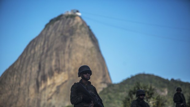 Military soldiers stand guard in Rio de Janeiro, Brazil.