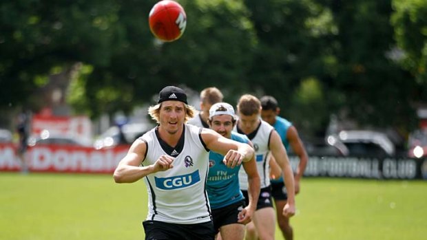 Fresh as a, well, daisy: Dale Thomas at training yesterday.