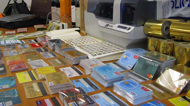 Some of the 15,000 false credit cards seized by police.