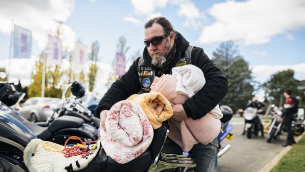 News 
Andy Caldwell offloads some blankets from his Harley to donate to the Salvation Army outside Old Parliament House on Saturday morning. 
9 May 2015
Photo: Rohan Thomson
The Canberra TImes