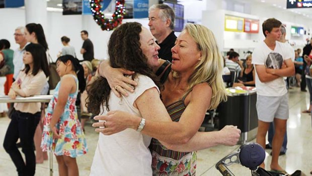 Presence wrapped with arms of love and joy &#8230; Margie Rawlinson welcomes her sister Janet Oag, who travelled from London, at Sydney Airport on Sunday.