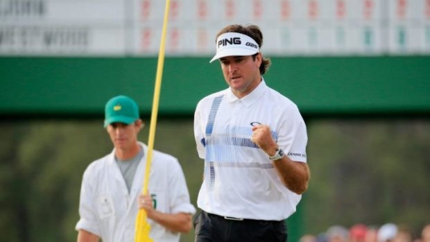  Bubba Watson celebrates on the 18th green after winning the 2014 Masters Tournament.