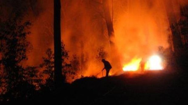 Firefighter battles a blaze alone.