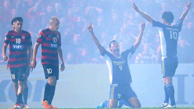 Fog descends: Kim Shin Wook of Ulsan Hyandai celebrates his goal during the AFC Asian Champions League match against the Wanderers.
