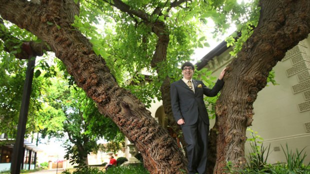 Stonnington mayor Claude Ullin stands in front of the mulberry tree in Malvern, Melbourne, which sprouted from a cutting from the original mulberry tree in Malvern, England.