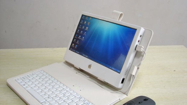 An iPad look-a-like using computer parts, a touch screen and a case with a keypad made by enterprising Chinese man Liu Xinying.