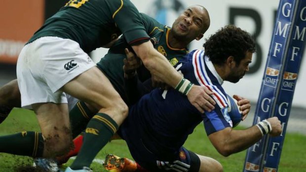 France's Yoann Huget scores a try in the final minute of the first half.