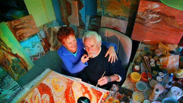 New perspective: Nick and Heather Safstrom with some of the paintings Nick has created since he lost the ability to communicate normally after a stroke eight years ago.
