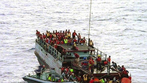 Australian navy personnel rescue asylum-seekers from a sinking boat off Christmas Island in 2001. The Howard Government later falsely claimed the refugees had thrown children overboard. <i>The Age</i> has tracked down an interviewed asylum seekers involved with the Tampa. Their stories are on this page.