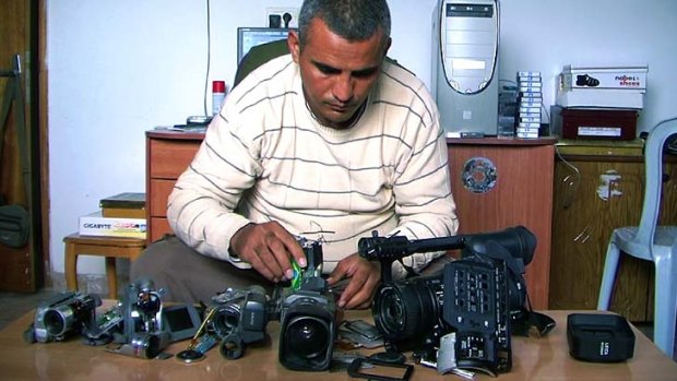 Tools of trade &#8230; Emad Burnat with his five broken cameras which he used to shoot his documentary on protests in the West Bank.
