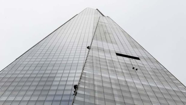 Making a point: Greenpeace demonstrators climb the Shard, the tallest building in Western Europe.