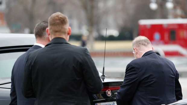 Secret Service agents change the licence plate on President Donald Trump's vehicle on January 20.