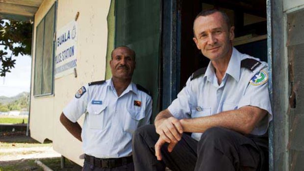 PNG Policeman Ben Pisoro and AFP policeman Mike Newbury at the Buala Police Station in the Solomons.