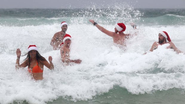 British travellers braved the weather to take a dip on Christmas Day at Bondi Beach.