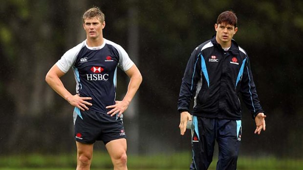 Rain check . . . Berrick Barnes and Tom Carter at training for their clash with the Rebels on Saturday. Barnes is expected to start after a month on the sidelines due to successive concussions.