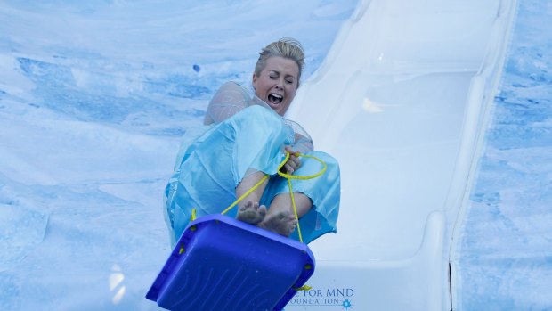 TV personality Samantha Armytage takes part in the slide. 