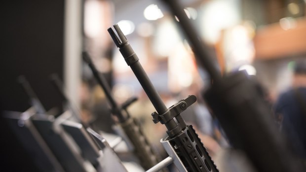 Rifles sit on display at a National Rifle Association annual show in Nashville.