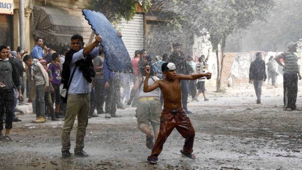 Protesters clash with police in Cairo on Thursday.