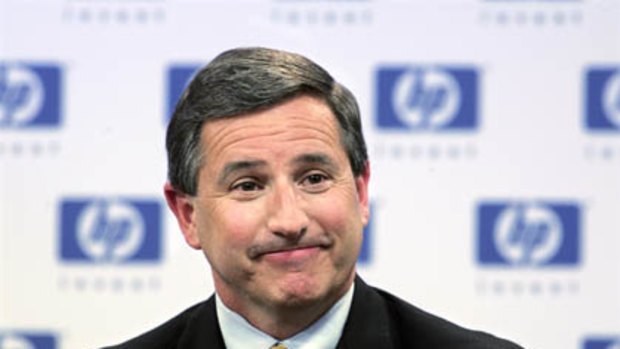 Former Hewlett-Packard Chief Executive Officer Mark Hurd smiles at a news conference.