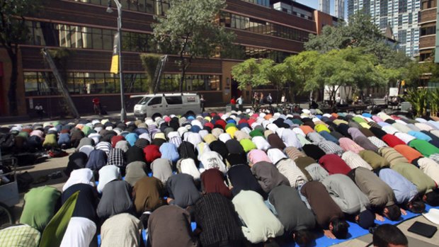Muslim RMIT students pray in Bowen Street yesterday.